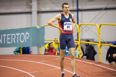 SUMY, UKRAINE - FEBRUARY 21, 2020: Yevhen Hutsol finishing 800m race at Ukrainian indoor track and...