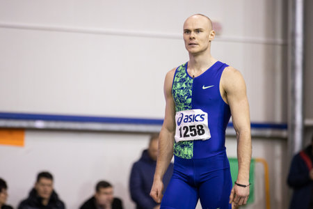 SUMY, UKRAINE - FEBRUARY 21, 2020: Serhiy Nykyforov champion in long jump contest at Ukrainian indoor track and field championship 2020.のeditorial素材