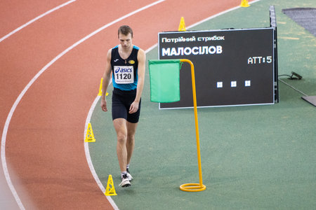 SUMY, UKRAINE - FEBRUARY 22, 2020: champion Oleksandr Malosilov in final triple jump contest at...