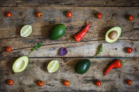 Guacamole ingredients flat layout on the wooden table. Culinary concept top view backgroundの写真素材