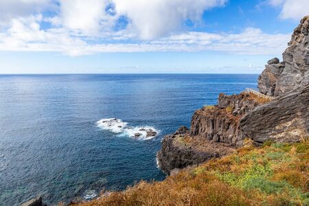 Volcanic cliff on the Tenerife coast near Puerto de la Cruz, Spain. Landscape of Tenerife northの写真素材