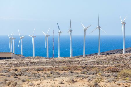 Windmill farm on Tenerife coast of the atlantic ocean. Renewable green energyの写真素材