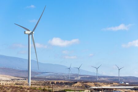 Wind eco energy concept image with copyspace. Wind generators at the mountain landscape