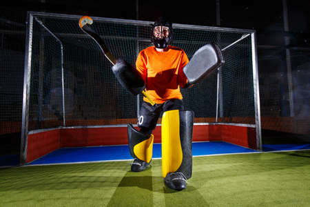Field hockey goalie at the net ready to defense.の写真素材