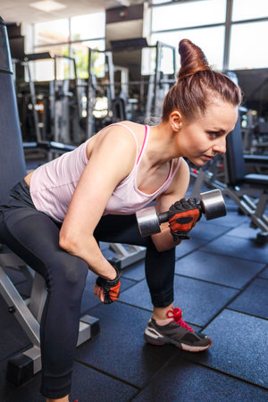 Young fitness woman doing training in the gym.の写真素材