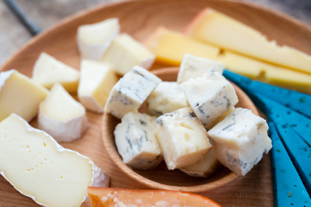 Close up image of different kinds of cheese on board. Cheese setの写真素材
