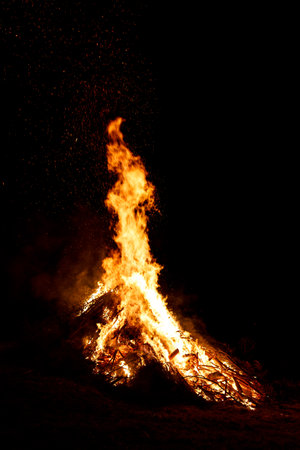 Big open fire at night on traditional festival in mountains. Bonfire at midsummerの写真素材