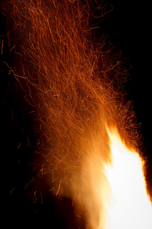 Big open fire at night on traditional festival in mountains. Bonfire at midsummerの写真素材