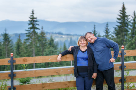 Happy senior couple spending time together in mountainsの写真素材