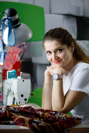 Young seamstress businesswoman at her workplace.の写真素材