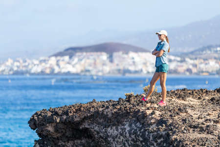 Young woman enjoying summer vacation near oceanの写真素材