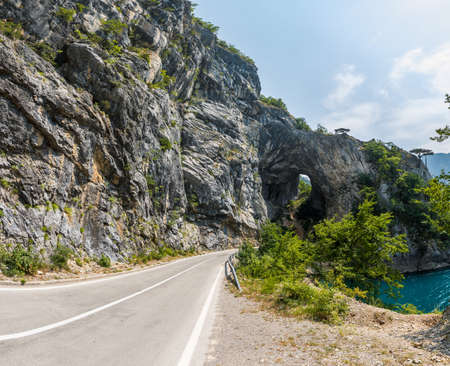 Wide angle view of mountain road along piva lake in Montenegro.の写真素材