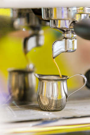 Making espresso with coffee machine at cafe.の写真素材