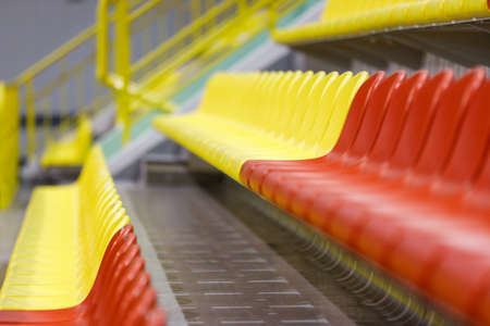 Empty rows of seats in sports arena because of pandemicの写真素材