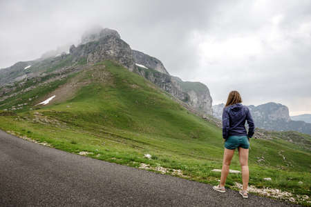 Young travel woman enjoying landscape view of Sedlo pass in Durmitor park, Montenegro