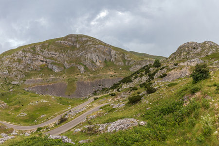 Mountain landscape with dramatic stormy clouds in skyの写真素材