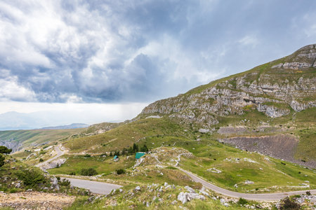 Mountain landscape with dramatic stormy clouds in skyの写真素材