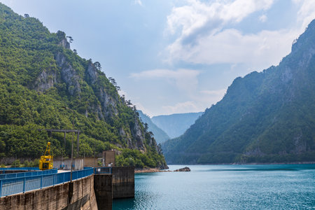 Landscape view of big lake between mountains at summer dayの写真素材