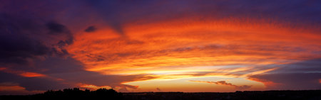 Vibrant Panoramic Sunset Over Horizon at Twilight