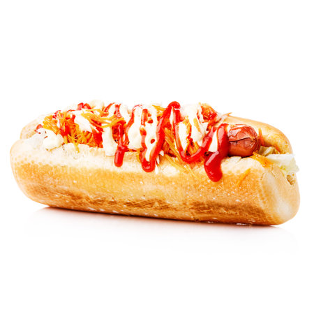 Fast food hot dog with toppings on a white backgroundの写真素材