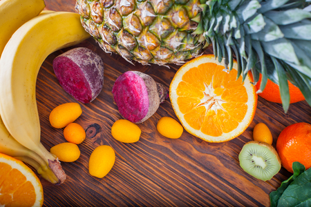 Fresh fruit and vegitables on wooden tableの写真素材