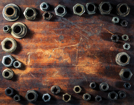 Screws on dirty wooden tableの写真素材