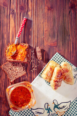 Rolls with chees and wholemeal bread with  red bell peppers relishの写真素材