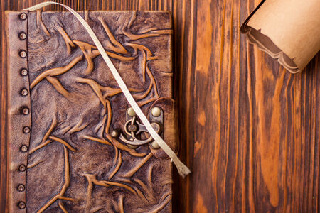 Old book and letter on wooden tableの写真素材