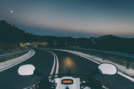 Bike drve at night on local road. First person view.