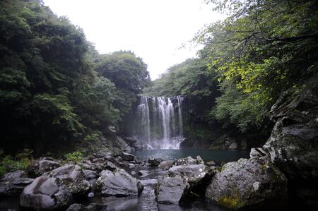 A waterfall in the mountainsの写真素材
