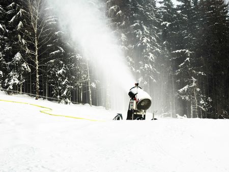 Snow cannon making new artificial snow