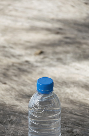 Plastic water bottle on wooden table texture. Fresh concept.の写真素材