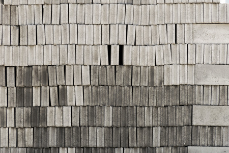 Many gray brick/concrete block texture background. a lot of overlap material prepare to built.の写真素材