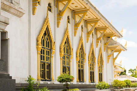 Detail of wall and window temple' construction with clear sky background at Wat Sothorn, Chachoengsao Thailand.の写真素材