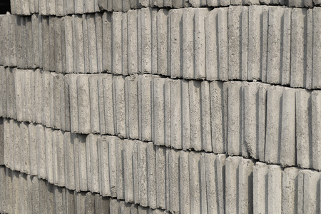 Many gray brick/concrete block texture background. a lot of overlap material prepare to built.の写真素材