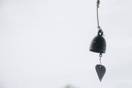 close up black bells with sky background.の写真素材
