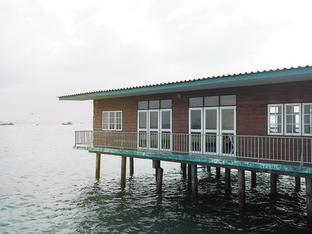 old house near water/canal in Thailand. Waterfront lifestyle. Cultural river.の写真素材