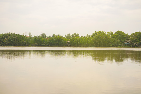 Landscape of river/lake and forest with blue sky background in Thailandの写真素材