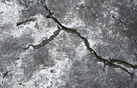 Crack in the concrete floor. Step in the walkの写真素材