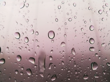 Water drop on mirror with emotional warmth.の写真素材