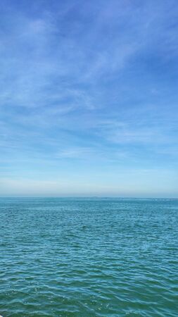 Blue sea/ocean and clouds sky abstract background in Thailand. horizon over view. summer relaxing time.の写真素材