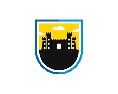 Simple shield with ancient fortress and sunset behindのイラスト素材