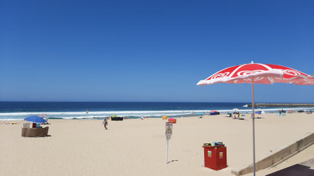 People on the beach in Espinho, Portugalの写真素材