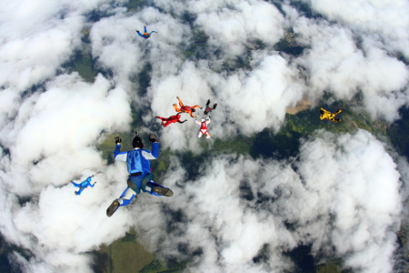 Skydivers above clouds.の写真素材