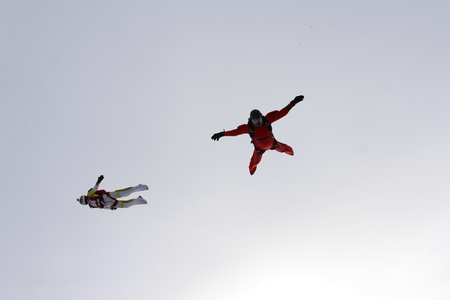 Skydivers are moving in the cloud.の写真素材