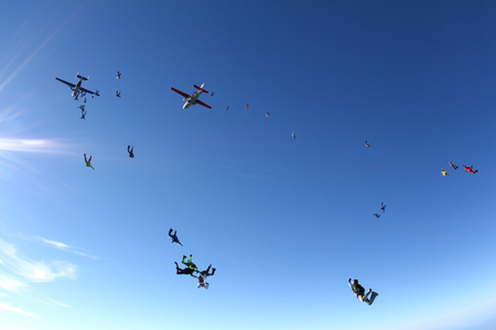 The skydiving exit from two airplanes.の写真素材
