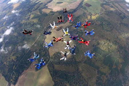 SKYDIVERS are making a figure in the sky.の写真素材