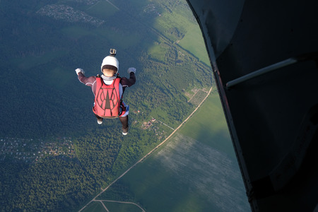 Skydiver has just jumped out of a plane.の写真素材