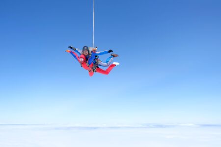 Skydiving. Amazing tandem jump in the sky.の写真素材