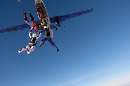 Skydiving. Group jump. Skydivers are doing a figure in the sky.の写真素材